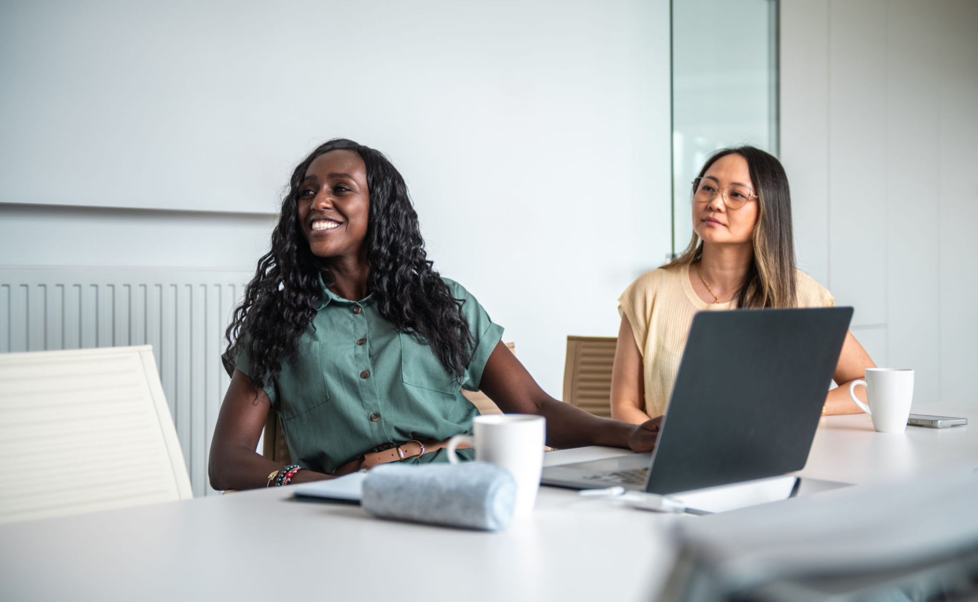 Two women in a meeting room